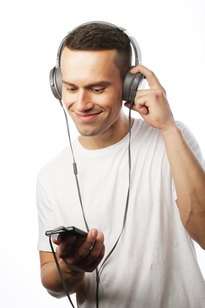 Handsome young man in headphones - Фото, зображення