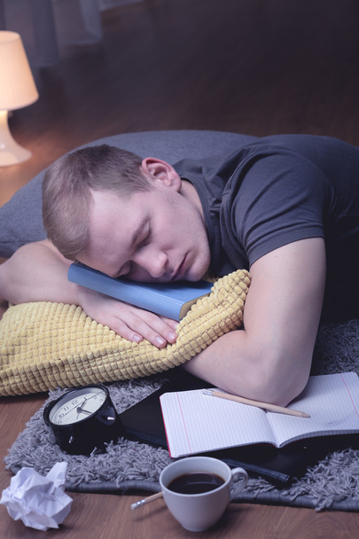 Man sleeping with notebook - Photo, Image