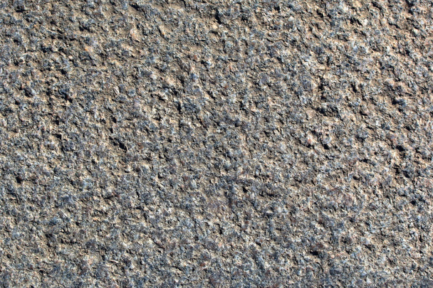 Texture of a old rough granite surface close-up - 写真・画像