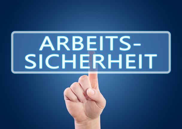 Arbeitssicherheit - german word for occupational safety - hand pressing button on interface with blue background. - Zdjęcie, obraz