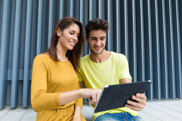 couple using digital tablet at outdoor - Photo, Image