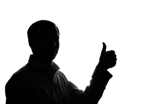 A young man showing thumb up - Foto, Imagen