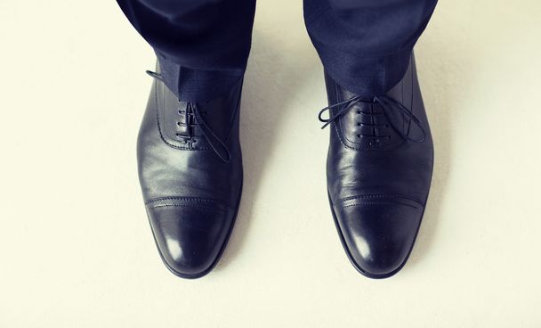 close up of man legs in elegant shoes with laces - Фото, изображение
