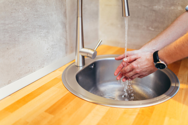 Washing hands keeps bacteria away - Foto, afbeelding