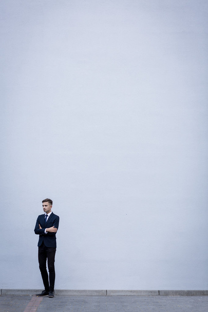 Businessman on white wall - Foto, Imagem