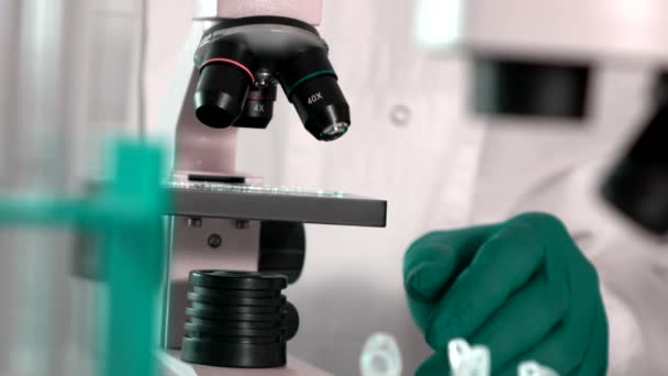 Researcher Working in Lab With Microscope.researcher in biochemical lab - Imágenes, Vídeo