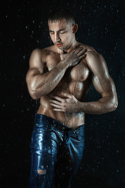 Wet body of a man with muscles. - Foto, Imagen