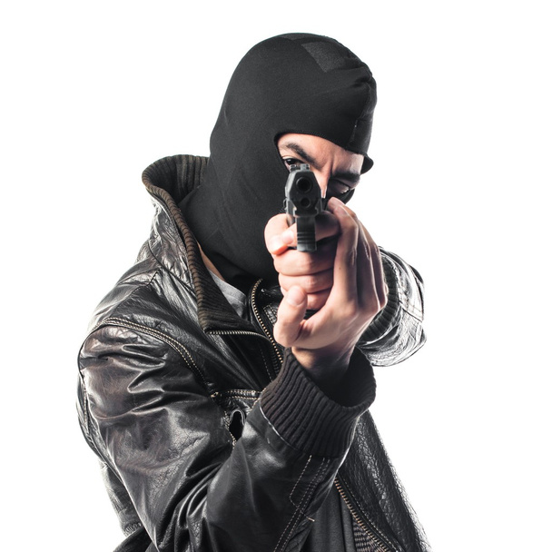 Robber shooting with a pistol - Photo, Image