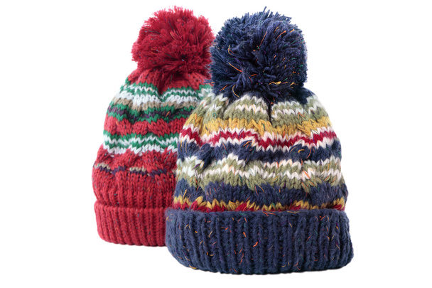 Два кучерявих в'язаних бульбашкових шапки або зимові капелюхи ізольовані на білому
 - Фото, зображення