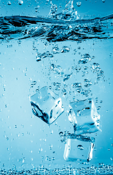 Ice cubes falling under water - Photo, image