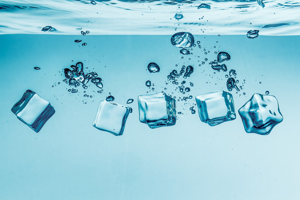 Ice cubes falling under water - Foto, imagen