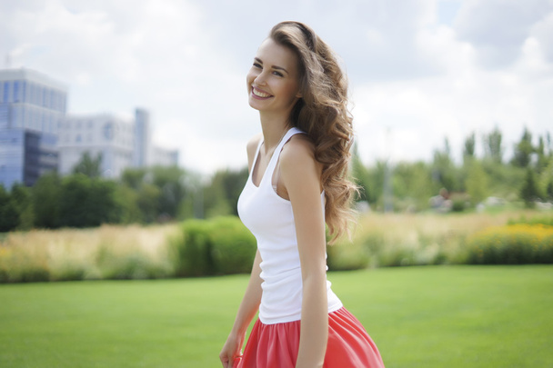 Happy young woman in the park - Photo, Image