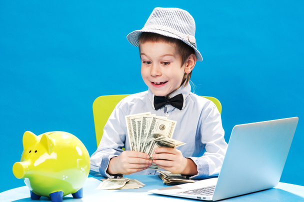 Little businessman counting money - Foto, Imagen