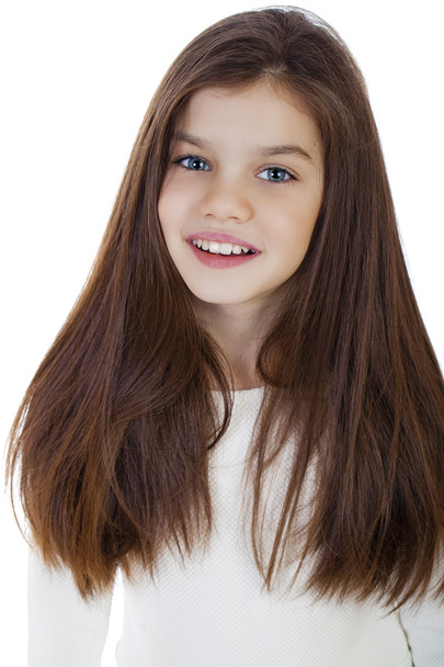 Portrait of a charming little girl smiling at camera - Фото, зображення
