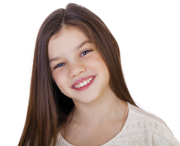 Portrait of a charming little girl smiling at camera - Фото, изображение