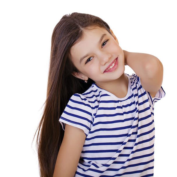 Portrait of a charming little girl smiling at camera - Foto, Imagen