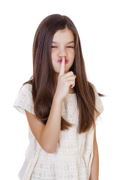 Little girl has put forefinger to lips as sign of silence - Фото, зображення
