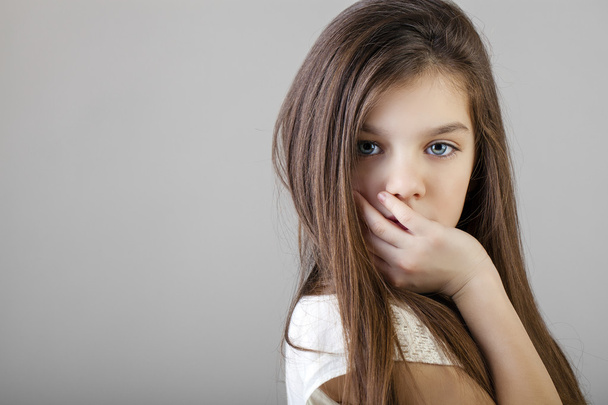 Portrait of a charming brunette little girl - Foto, Imagen