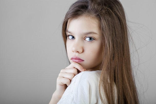 Portrait of a charming brunette little girl - Fotó, kép
