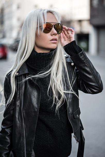 Portrait of beautiful blonde girl in sunglasses outdoors - Photo, image