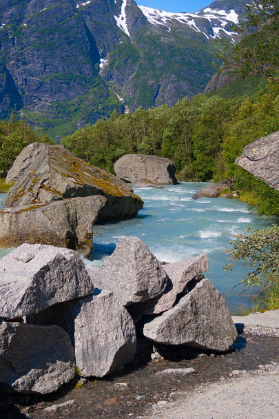 Norway. Water flow from the thawing glacier Briksdayl in mountai - Zdjęcie, obraz