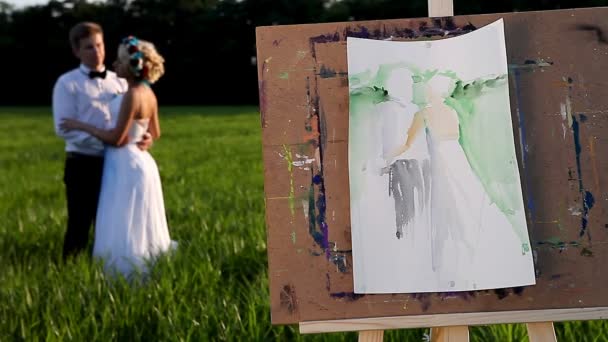művész festőállvány a szabadban, és a pár - Felvétel, videó