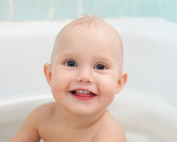 Smiling baby in bath - Photo, Image