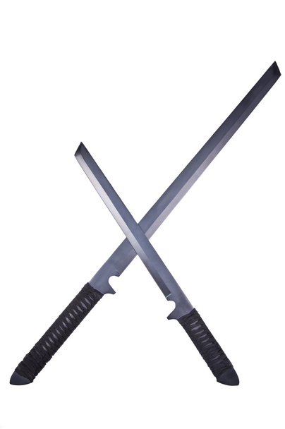 Duas espadas ninja cruzadas
 - Foto, Imagem