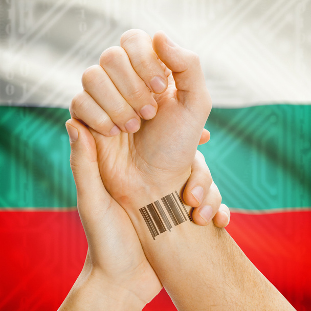 Barcode ID number on wrist and national flag on background series - Bulgaria - Foto, Imagen