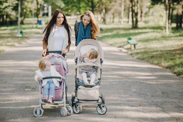 Family walk in the park - Фото, изображение