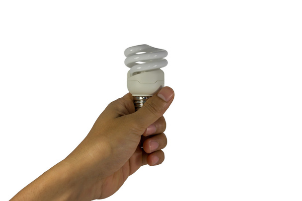 Elektrische lamp in hand op een witte achtergrond - Foto, afbeelding