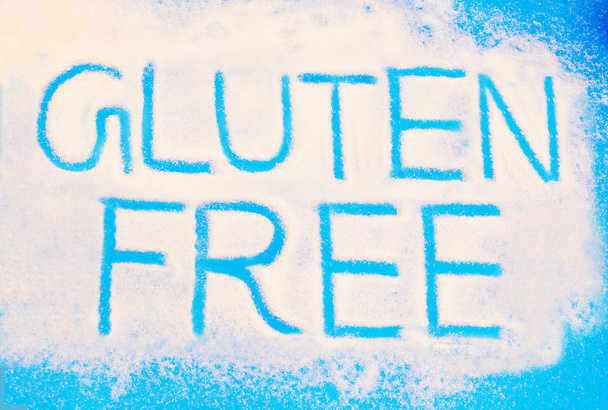 Libre de gluten escrito sobre fondo de azúcar
 - Foto, imagen