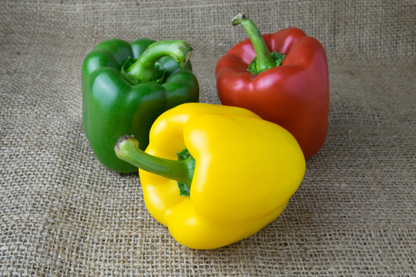 Colored bell peppers on wooden table - Photo, Image
