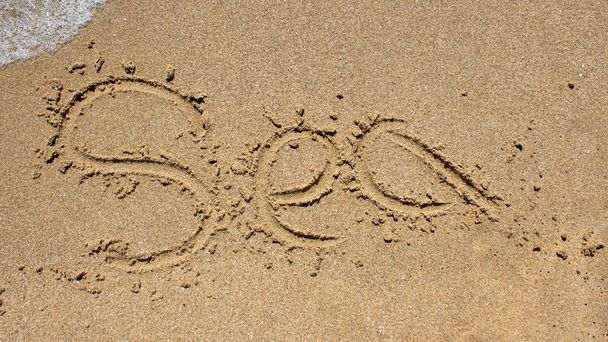 Sea word written on beach sand. - Fotografie, Obrázek