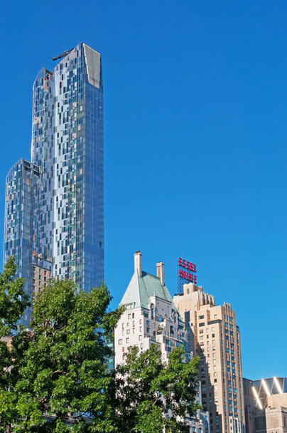 New York City: kaupungin ikoninen horisontti Central Parkista nähtynä, kuuluisa kaupunkipuisto Manhattanilla Upper West Siden ja Upper East Siden välissä
 - Valokuva, kuva