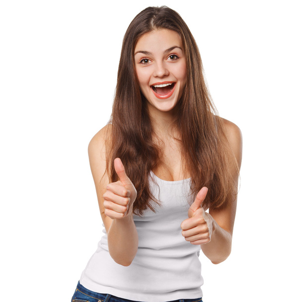 Smiling happy young woman showing thumbs up, isolated on white background - Foto, Imagen