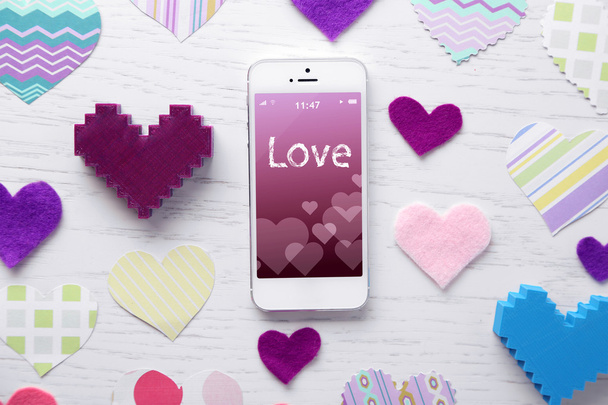 White smart phone with hearts  - Photo, Image