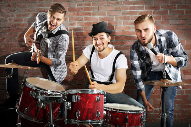 Musicians playing drums and guitar - Photo, Image