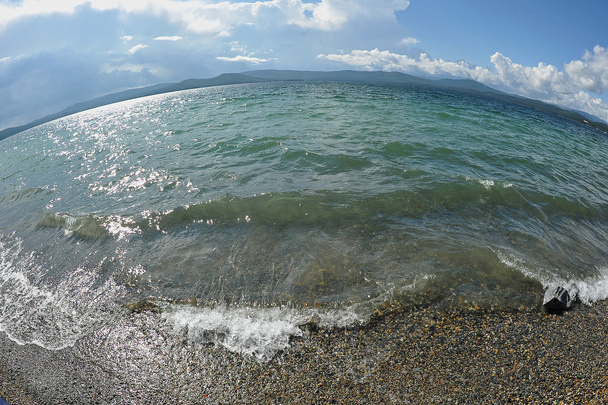 фон піщаних пляжів, хвиль і штормових хмар над
 - Фото, зображення