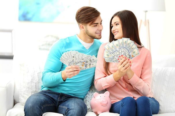 Happy couple counting money - Foto, imagen