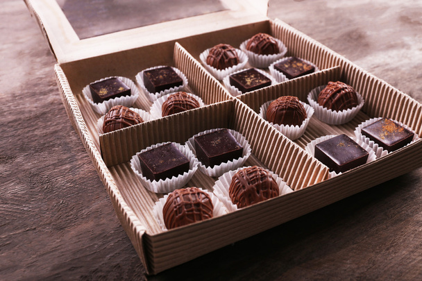 Delicious chocolate candies in paper box - Valokuva, kuva
