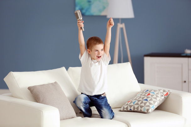 Little boy dancing with microphone - Zdjęcie, obraz
