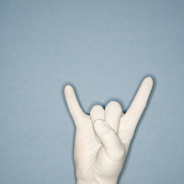 Rubber gloved hand gesture. - Photo, Image