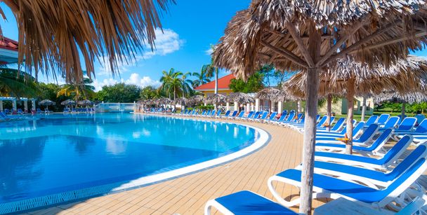 Beautiful blue sky holiday in Cuba.  View from pool,  getaway vacation in Varadero. - Photo, Image