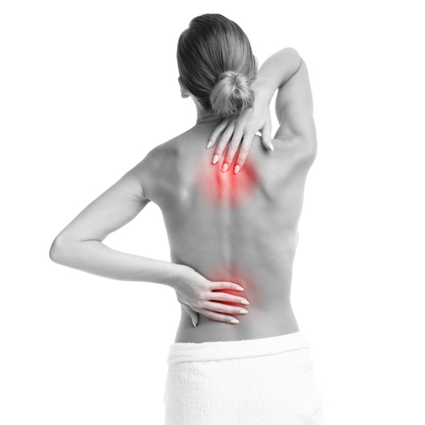 Mujer desnuda con dolor de espalda
 - Foto, imagen