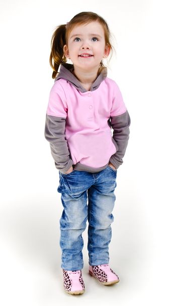 Portrait of happy smiling little girl in jeans - Fotografie, Obrázek