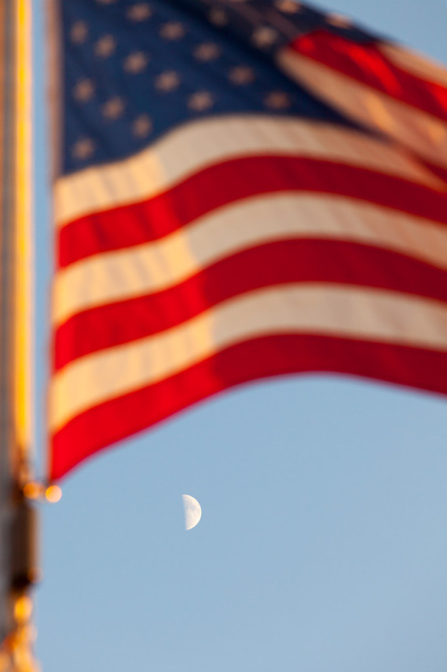 American flag flying and a Moon - Valokuva, kuva