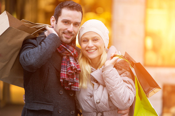 Young attractive couple with shopping bags - Photo, image
