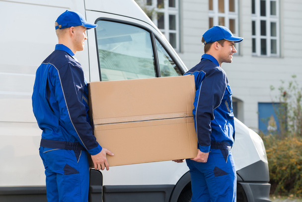 Delivery Men Carrying Cardboard Box - Photo, image