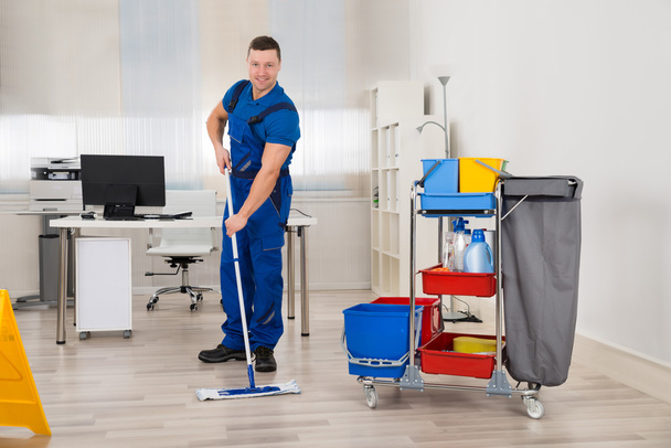 Janitor Mopping Floor In Office - Foto, imagen